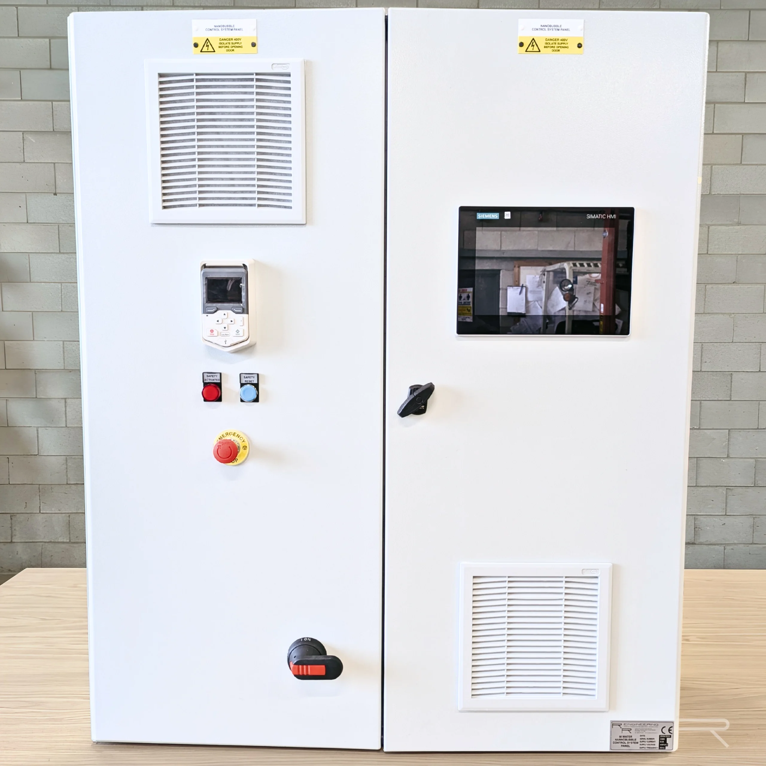 White IP55 double-door control panel with 10.1" Siemens HMI, VSD keypad and door-interlocked isolator
